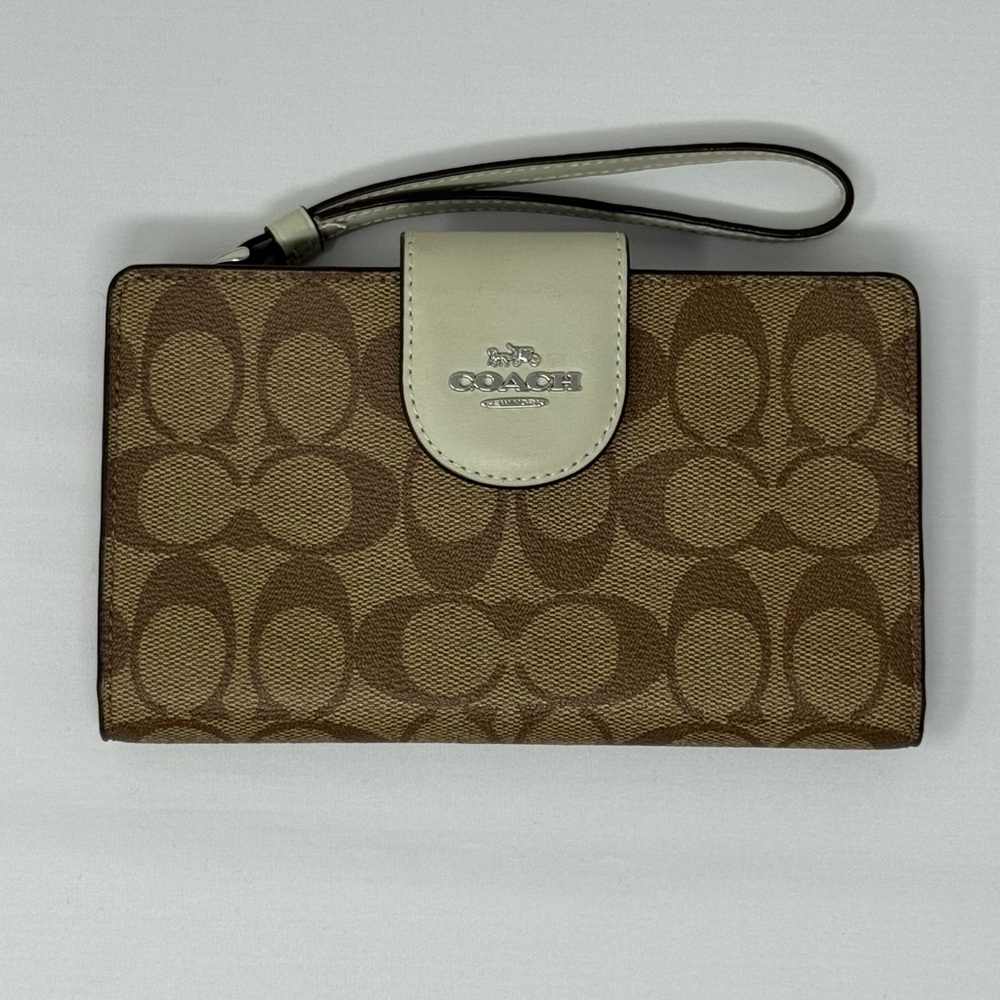 Coach Tan and Brown Signature Wristlet, In coated canvas. Credit card slots.